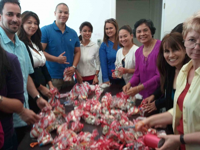 Agents from Savio Realty Oahu preparing toiletry bags for the homeless. From left: Michael Reese, Cathy Hotta, Jordan Chow, Janice Tanouye, Madeline Mason, Tammy Wasai, Cely Querido, Iris Khan, Urzula Cwiklinska 